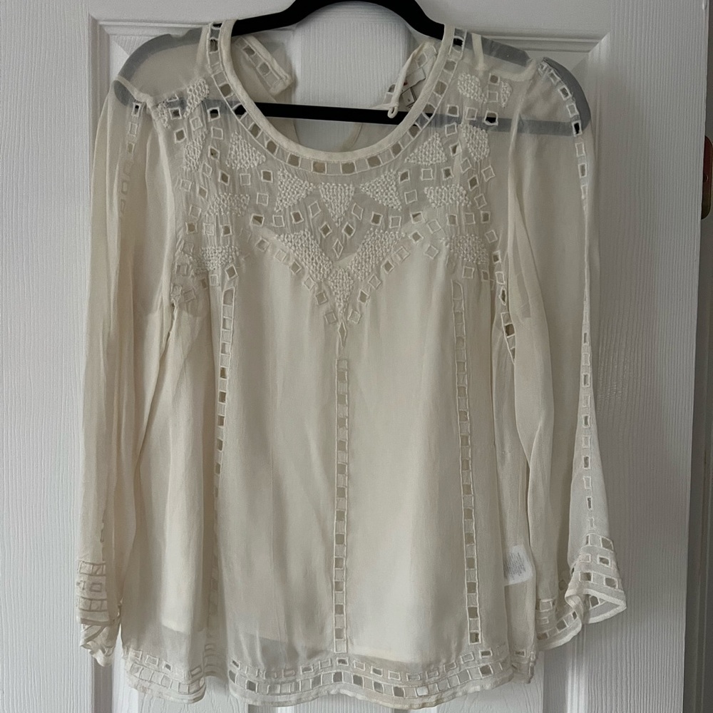 Cream colored Joie blouse with cut out eyelet detail